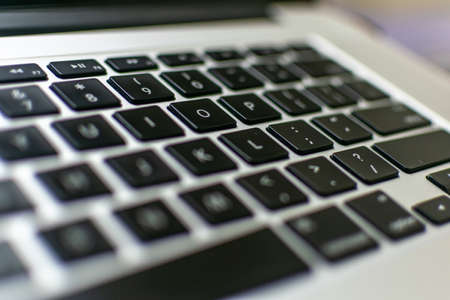 A selective focused view of a laptop key board with blurred edgesの写真素材