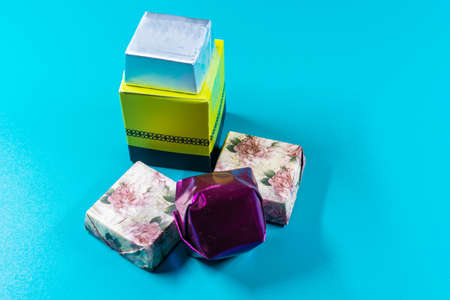 a couple of chocolate gifts with an isolated blue background with place to add text