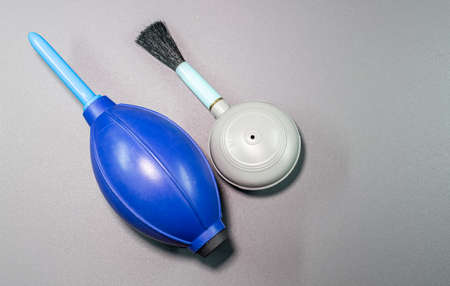An isolated view of hand blower brush and blower in a gray backgroundの写真素材