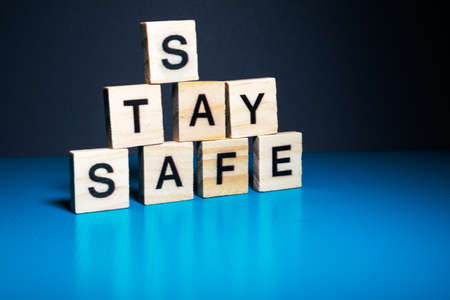 the word corona and stay safe arranged nicely on a colorful background with space for textsの写真素材