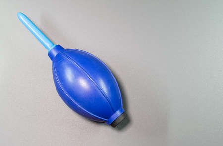An isolated view of hand blower in a gray background