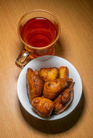 black tea with snacks on a table in a beautiful lightingの写真素材
