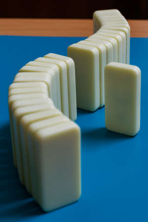 dominoes blocks in social distancing theme, with blue backgroundの写真素材