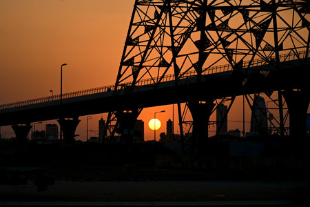 Silhouette of a bridge at sunset in Riyadh, Saudi Arabia.