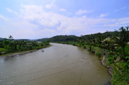 river brown and green hillsの写真素材