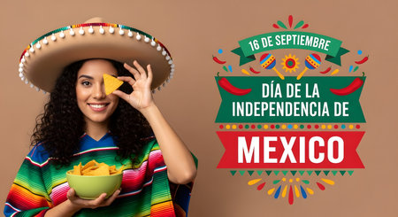 happy young woman in mexican sombrero holding bowl with nachosの素材