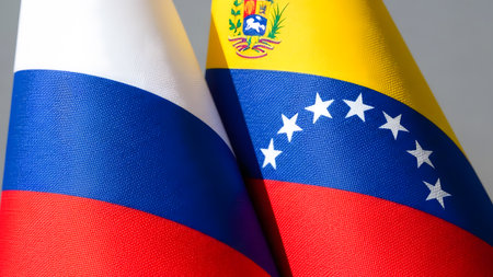Two flags of Russia and the Republic of Venezuela on a gray backgroundの素材
