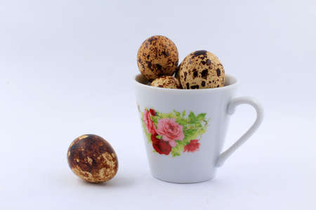 The quail eggs inside the white cupの写真素材