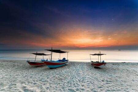 fisherman boats, parked at the beach during sunrise