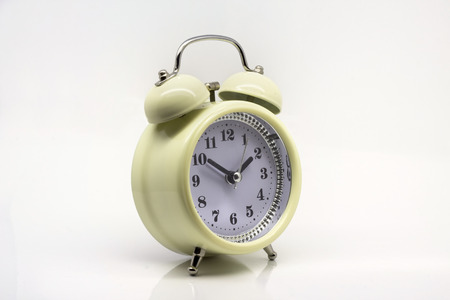 White vintage clock on isolated white background