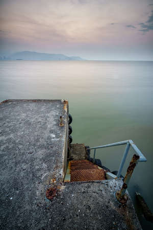 The Jetty. Shoot with long exposure during cloudy sunset.の写真素材