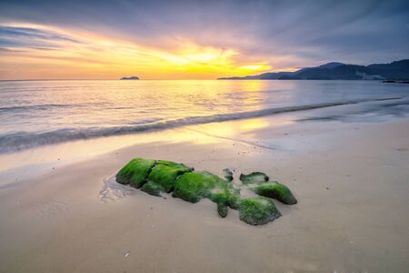 Panoramic view of  the golden sunset at Sungai Batu beach, Teluk Kumbar