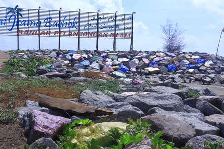 Bachok, Malaysia - March 21 2021 : The landmark sign of Pantai Irama Bachok stands of the colourful rocks at Pantai Irama Beach in Bachok District of Kelantan, Malaysia.のeditorial素材