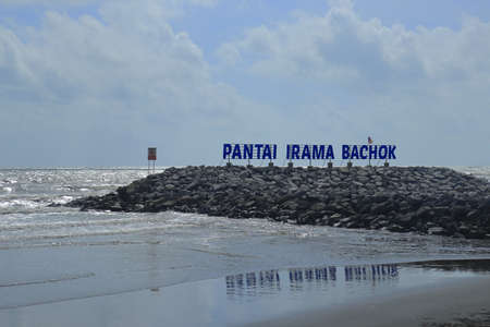 Bachok, Malaysia - March 21 2021 : Landmark signpost of Pantai Irama Bachok stood on the rocks at the beach of Pantai Irama the Bachok District of Kelantan, Malaysia.のeditorial素材