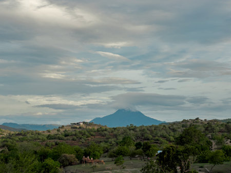 The lush, green hills with beautiful trees showcase the towering Seulawah Mountain in Aceh.の写真素材