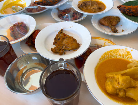 Simpel Padang rice consists of several dishes from Padang cuisine served with various side dishes on a white plate at a simple Padang restaurant.の写真素材