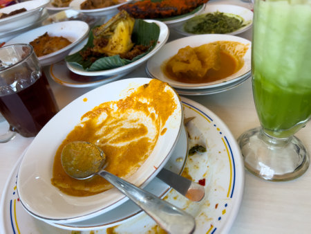 Simpel Padang rice consists of several dishes from Padang cuisine served with various side dishes on a white plate at a simple Padang restaurant.の写真素材