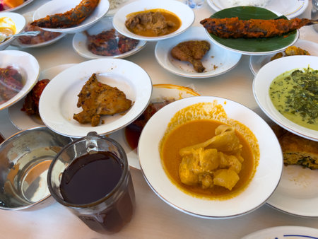 Simpel Padang rice consists of several dishes from Padang cuisine served with various side dishes on a white plate at a simple Padang restaurant.の写真素材