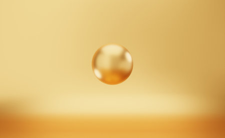3d rendering of a golden ball on a yellow background with a blurred backgroundの写真素材