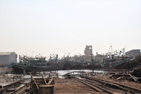 fishing boats parked on the coast of Jakartaの写真素材