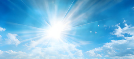 Rays of the sun from behind the clouds in the blue skyの素材