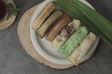 Kue Pukis is a traditional Indonesian snack.Made with a simple batter of eggs, sugar, and flour.The golden-brown top of the Kue Pukis is a perfect contrast to the white and fluffy texture of the cake.の写真素材