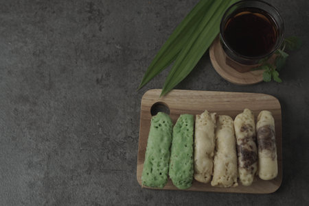 Kue Pukis are traditional Indonesian cakes. Made with a simple batter of eggs, sugar, and flour, these round treats are a sweet addition to any snack time. Enjoy with a cup of tea or coffee.の写真素材