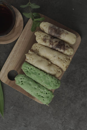 Kue Pukis are traditional Indonesian cakes. Made with a simple batter of eggs, sugar, and flour, these round treats are a sweet addition to any snack time. Enjoy with a cup of tea or coffee.の写真素材