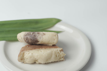 Kue Pukis with an isolated white background. These traditional Indonesian snacks are made with a combination of rice flour, coconut and brown sugar.の写真素材