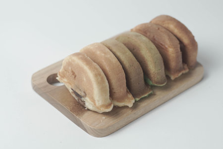 Kue Pukis with an isolated white background. These traditional Indonesian snacks are made with a combination of rice flour, coconut and brown sugar.の写真素材