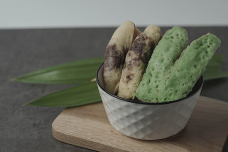 Kue Pukis is a traditional Indonesian snack.Made with a simple batter of eggs, sugar, and flour.The golden-brown top of the Kue Pukis is a perfect contrast to the white and fluffy texture of the cake.の写真素材