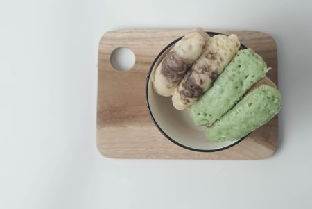Kue Pukis with an isolated white background. These traditional Indonesian snacks are made with a combination of rice flour, coconut and brown sugar.の写真素材
