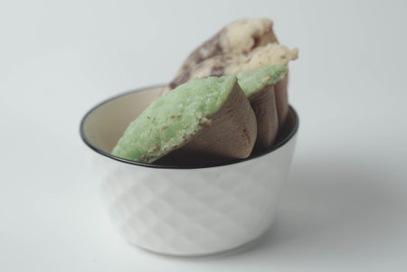 Kue Pukis with an isolated white background. These traditional Indonesian snacks are made with a combination of rice flour, coconut and brown sugar.の写真素材