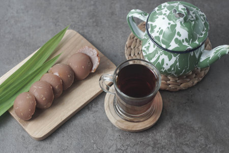 Traditional Javanese tea served with palm sugar for a sweet, creamy flavor. Enjoy the authentic taste of Indonesia in every sipの写真素材