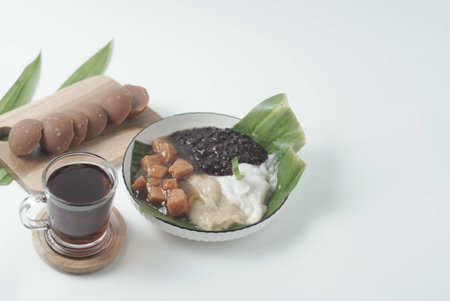 A traditional Indonesian dish, Bubur Merah Putih is made with boiled red rice, coconut milk, and sugar. Served with tea, this comforting dessert is a surefire crowd-pleaser.の写真素材