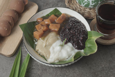 A traditional Indonesian dish, Bubur Merah Putih is made with boiled red rice, coconut milk, and sugar. Served with tea, this comforting dessert is a surefire crowd-pleaser.の写真素材