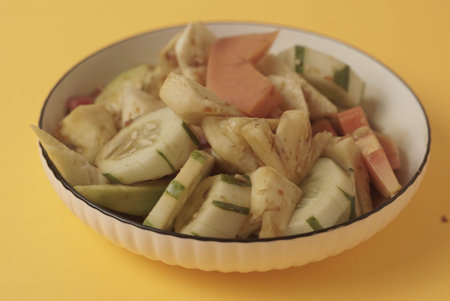 Rujak Buah is an Indonesian dessert consisting of fresh tropical fruit. That is mixed with a sweet and spicy sauce made from palm sugar, tamarind, chili, garlic and salt. Selective focus , Closeupの写真素材