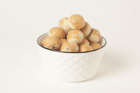 Kue nastar , This golden-brown treat is filled with a mouth-watering blend of buttery goodness and tangy pineapple jam, perfectly balanced to create a delectable flavor that's hard to resist.の写真素材