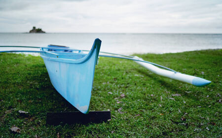 Beautiful blue small blue boat fishermanの写真素材