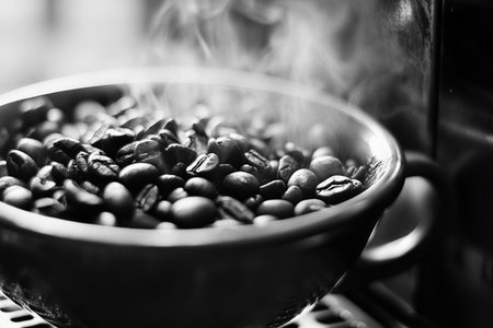 Coffee beans in a bowl on the stove. Black and white.の素材