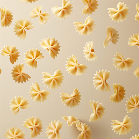 Seamless pattern made of farfalle pasta on beige backgroundの素材