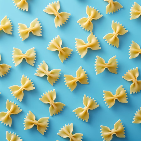 Farfalle pasta on blue background. Flat lay, top viewの素材