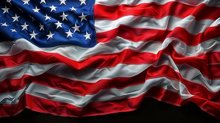 Close-up of a waving American flag, symbolizing freedom, patriotism, and national pride. The stars and stripes are prominently displayed in this vibrant image.の素材