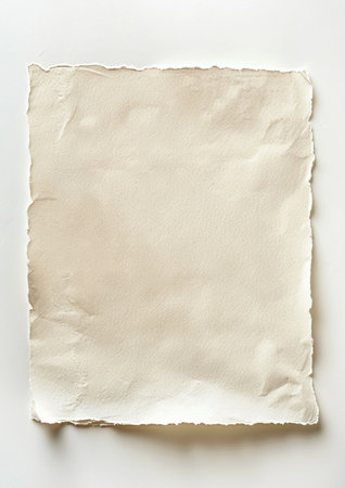 A close-up view of a single sheet of crumpled beige paper with ragged, torn edges. The textured surface provides a blank canvas for design.の素材