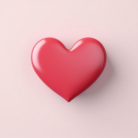 A smooth, shiny red heart icon with soft shadow details, presented on a pastel pink surface. A clear symbol of love and affection.の素材
