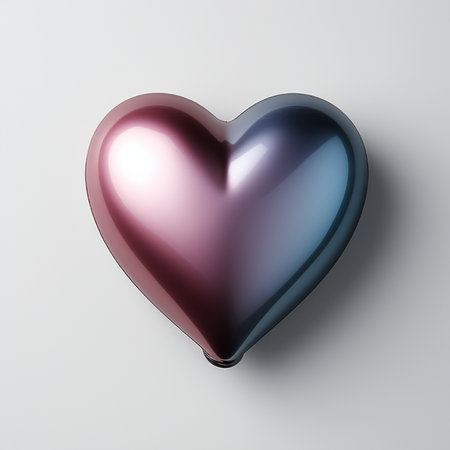A metallic heart-shaped object with a smooth, reflective surface displaying a gradient of pink and blue colors against a plain white backdrop.の素材