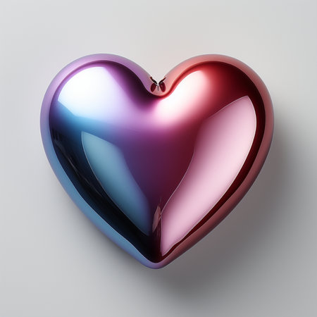 A polished, heart-shaped object with a smooth, reflective surface displaying a gradient of red, blue, and purple colors. Isolated on a clean white background.の素材