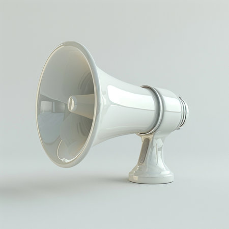 A high-gloss white megaphone, a symbol of announcement and communication, displayed against a clean, light gray backdrop. Simple studio shot.の素材