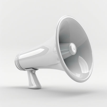 A clean, white megaphone in a studio setting. The object is presented against a plain, light gray backdrop.の素材