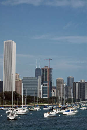 Sailboat docking on the city shore.の写真素材